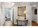 Bright and airy entryway with wood floors, a console table, and mirror at 5153 Isla Key S Blvd # 412, St Petersburg, FL 33715