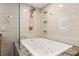 Bathroom features a soaking tub, walk-in shower, and modern fixtures at 5153 Isla Key S Blvd # 412, St Petersburg, FL 33715