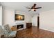 Living room with hardwood floors, fireplace and access to balcony at 5153 Isla Key S Blvd # 412, St Petersburg, FL 33715