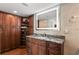 Bathroom with granite countertop, modern vanity, and shoe storage at 5153 Isla Key S Blvd # 412, St Petersburg, FL 33715