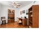 Home office with hardwood floors, built-in shelving, and desk at 5153 Isla Key S Blvd # 412, St Petersburg, FL 33715