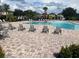 Inviting community pool with plenty of lounge chairs at 9143 Hillcroft Dr, Riverview, FL 33578