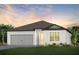 Charming one-story home with gray garage and landscaping at 13715 Brookside Haven St, Riverview, FL 33578