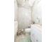 Clean bathroom with light gray tiled walls and white vanity at 6515 Los Altos Way, Tampa, FL 33634