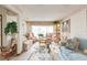 Bright living room with floral sofas and a coffee table at 6515 Los Altos Way, Tampa, FL 33634