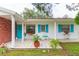 Inviting front porch with tiled flooring and potted plants at 6515 Los Altos Way, Tampa, FL 33634