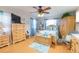 Spacious bedroom with light wood furniture and ceiling fan at 6515 Los Altos Way, Tampa, FL 33634