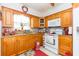 Cozy kitchen with wood cabinets and granite countertops at 6515 Los Altos Way, Tampa, FL 33634