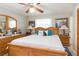 Main bedroom with a wood bed frame and ample natural light at 6515 Los Altos Way, Tampa, FL 33634