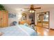 Large bedroom with mirrored closet doors and wood furniture at 6515 Los Altos Way, Tampa, FL 33634