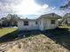 White, single-story house with a simple design at 17025 Dalberg Dr, Spring Hill, FL 34610