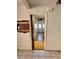A long hallway with checkered tile floors at 17025 Dalberg Dr, Spring Hill, FL 34610