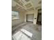 Another simple bedroom with worn flooring and a window at 17025 Dalberg Dr, Spring Hill, FL 34610