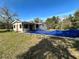 Home with a covered patio and pool at 17025 Dalberg Dr, Spring Hill, FL 34610