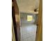 Large bedroom with tiled floors and a ceiling fan; needs cosmetic updates at 17025 Dalberg Dr, Spring Hill, FL 34610
