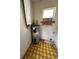 Laundry room with water heater and cabinets at 17025 Dalberg Dr, Spring Hill, FL 34610