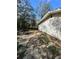 Side yard of the property with debris at 17025 Dalberg Dr, Spring Hill, FL 34610