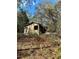 Distressed house needing major repairs, surrounded by woods at 17025 Dalberg Dr, Spring Hill, FL 34610