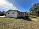 Ranch-style home with stucco exterior, set on a grassy lot at 17025 Dalberg Dr, Spring Hill, FL 34610
