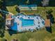 Relaxing community pool and patio area at 1450 Heather Ridge Blvd # 107, Dunedin, FL 34698