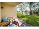 Serene patio with water views and comfortable seating at 1450 Heather Ridge Blvd # 107, Dunedin, FL 34698