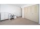 Bedroom with built-in dresser and closet at 1450 Heather Ridge Blvd # 107, Dunedin, FL 34698