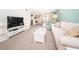 Open living room showcasing comfortable seating and built-in shelving at 1450 Heather Ridge Blvd # 107, Dunedin, FL 34698