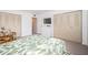 Bedroom with a leafy print bedspread and built-in dresser at 1450 Heather Ridge Blvd # 107, Dunedin, FL 34698