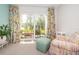 Relaxing living area with access to a private patio and lush landscaping at 1450 Heather Ridge Blvd # 107, Dunedin, FL 34698