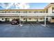 Covered parking area for building residents at 1450 Heather Ridge Blvd # 107, Dunedin, FL 34698
