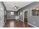 Living room with gray walls, hardwood floors, and ceiling fan at 906 Jurgens St, Clearwater, FL 33755