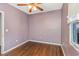 Simple bedroom with wood flooring and ceiling fan at 906 Jurgens St, Clearwater, FL 33755