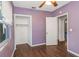 Bedroom with wood floors, closet, and ceiling fan at 906 Jurgens St, Clearwater, FL 33755