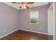 Cozy bedroom with wood floors and a ceiling fan at 906 Jurgens St, Clearwater, FL 33755
