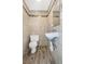 Small half bathroom with updated tile at 906 Jurgens St, Clearwater, FL 33755