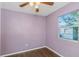 Bedroom with wood floors, ceiling fan, and window at 906 Jurgens St, Clearwater, FL 33755