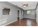 Bright living room featuring hardwood floors and ceiling fan at 906 Jurgens St, Clearwater, FL 33755