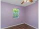 Simple bedroom with wood flooring and window at 906 Jurgens St, Clearwater, FL 33755