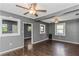 Living room with hardwood floors, ceiling fan, and open layout at 906 Jurgens St, Clearwater, FL 33755