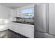 Kitchen with white cabinets, granite countertops, and stainless steel appliances at 906 Jurgens St, Clearwater, FL 33755