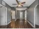Spacious living area with hardwood floors and ceiling fan at 906 Jurgens St, Clearwater, FL 33755