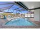 Relaxing pool area with covered patio and canal view at 229 Tallahassee Ne Dr, St Petersburg, FL 33702