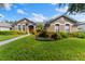 Two-story house with landscaped yard and walkway at 15212 Kestrelrise Dr, Lithia, FL 33547