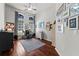 Bright home office features hardwood floors, built-in shelving, and plenty of natural light at 15212 Kestrelrise Dr, Lithia, FL 33547