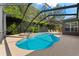 Inviting kidney-shaped pool with spa and screened enclosure at 15212 Kestrelrise Dr, Lithia, FL 33547