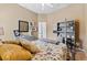 Cozy bedroom with a double bed, dresser, and decorative pillows at 15212 Kestrelrise Dr, Lithia, FL 33547