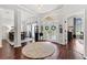 Elegant entryway with hardwood floors, double doors, and views into the living and dining areas at 15212 Kestrelrise Dr, Lithia, FL 33547