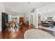 Spacious living area with hardwood floors, ample natural light, and a view of the dining room at 15212 Kestrelrise Dr, Lithia, FL 33547