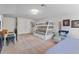 Multipurpose bedroom with bunk bed, desk, and comfortable seating at 15212 Kestrelrise Dr, Lithia, FL 33547