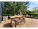 Outdoor kitchen with built-in grill and seating area at 15212 Kestrelrise Dr, Lithia, FL 33547